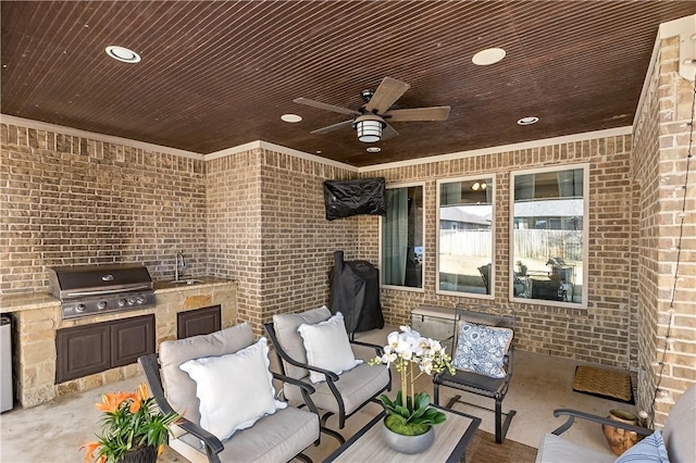 view of patio / terrace with outdoor lounge area, area for grilling, ceiling fan, a sink, and exterior kitchen