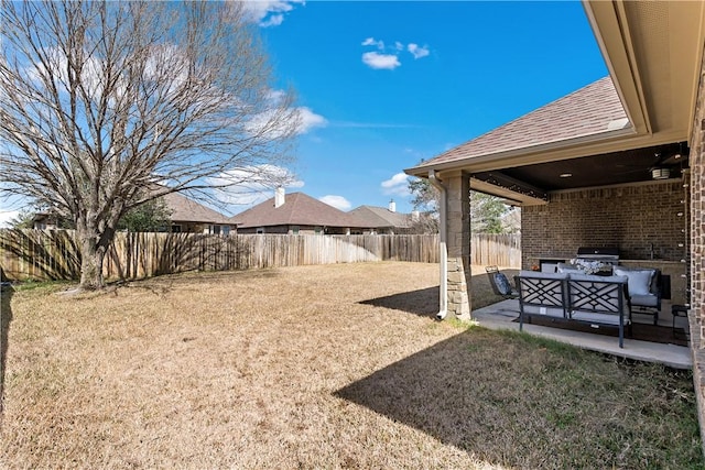 view of yard featuring a patio area, a fenced backyard, and an outdoor hangout area