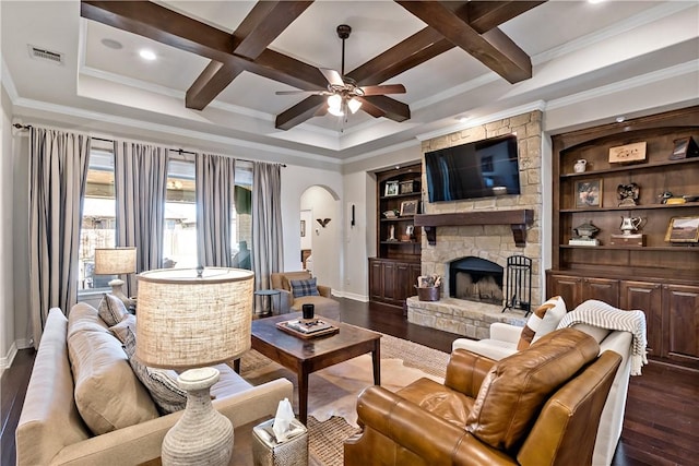 living area with visible vents, coffered ceiling, arched walkways, dark wood-style flooring, and a fireplace