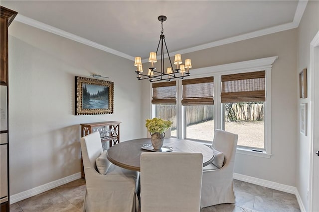 dining space featuring ornamental molding, a notable chandelier, and baseboards