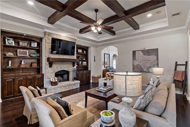 living room with visible vents, arched walkways, coffered ceiling, dark wood-style floors, and a stone fireplace