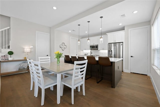 273 Estates Cir, College Station, TX 77840 - dining space with wood finished floors, recessed lighting, and stairs