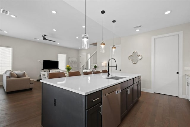 273 Estates Cir, College Station, TX 77840 - kitchen with dishwasher, a sink, dark wood finished floors, light countertops, and recessed lighting
