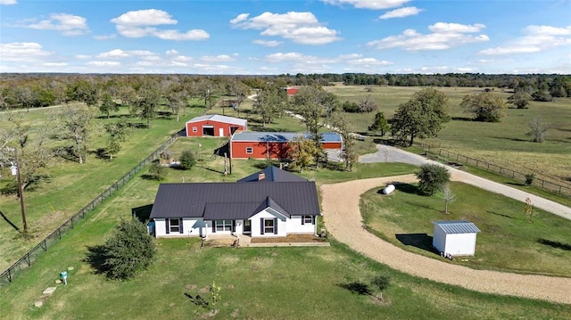 birds eye view of property with a rural view