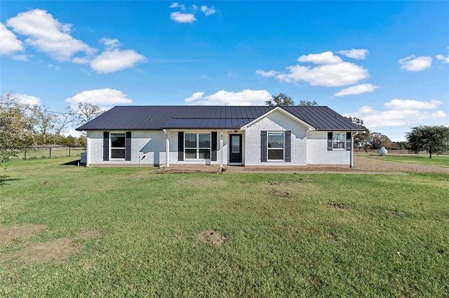 ranch-style home with a front lawn