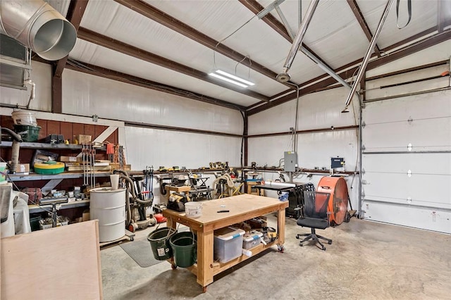 garage featuring a workshop area and electric panel