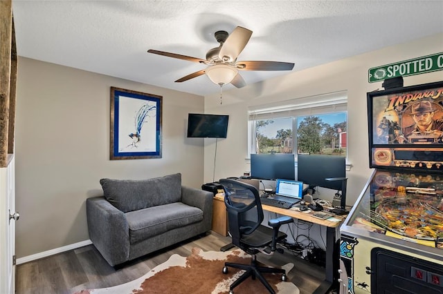 home office with hardwood / wood-style floors, a textured ceiling, and ceiling fan