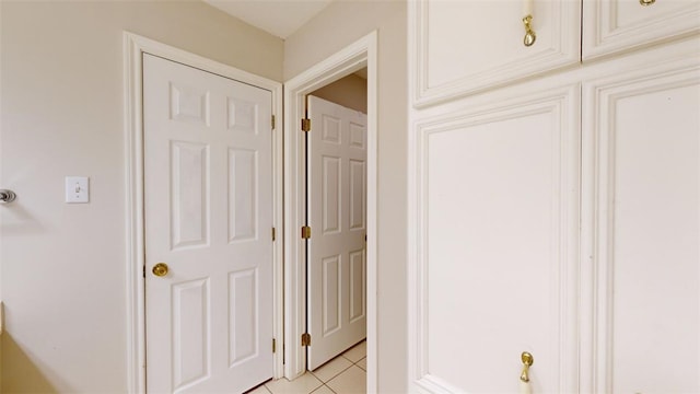 hallway featuring light tile patterned floors