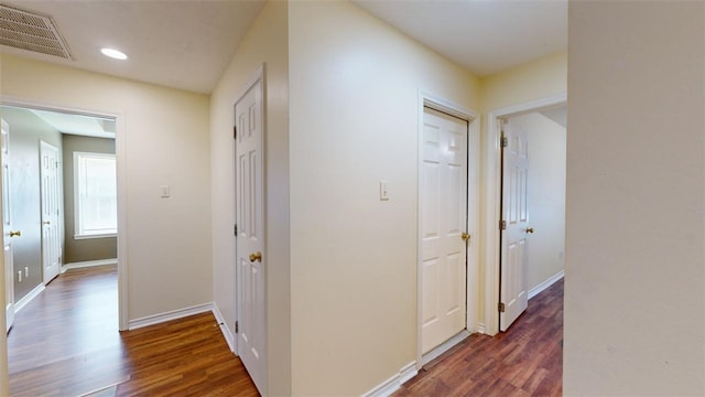 hallway featuring dark wood-type flooring