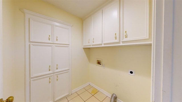 clothes washing area featuring washer hookup, light tile patterned floors, cabinets, and hookup for an electric dryer