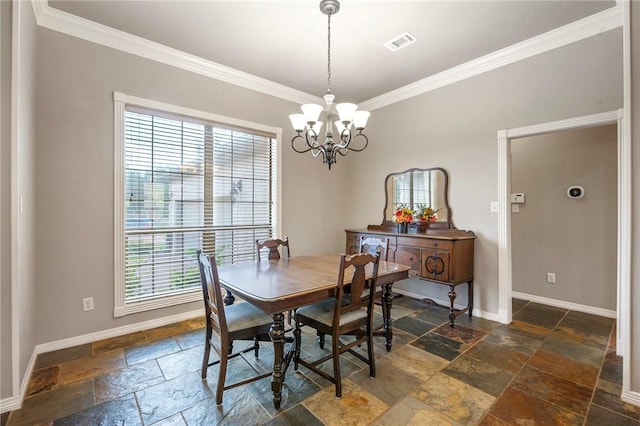 4413 Hearst Ct, College Station, TX 77845 - dining room featuring stone tile floors, plenty of natural light, crown molding, and a chandelier