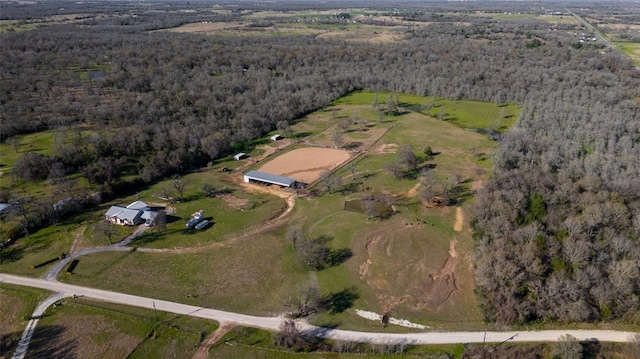 aerial view with a rural view and a wooded view