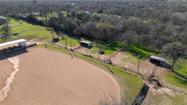 bird's eye view featuring a forest view and a rural view