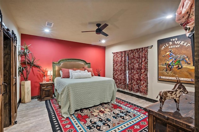 bedroom with visible vents, recessed lighting, a ceiling fan, and wood finished floors