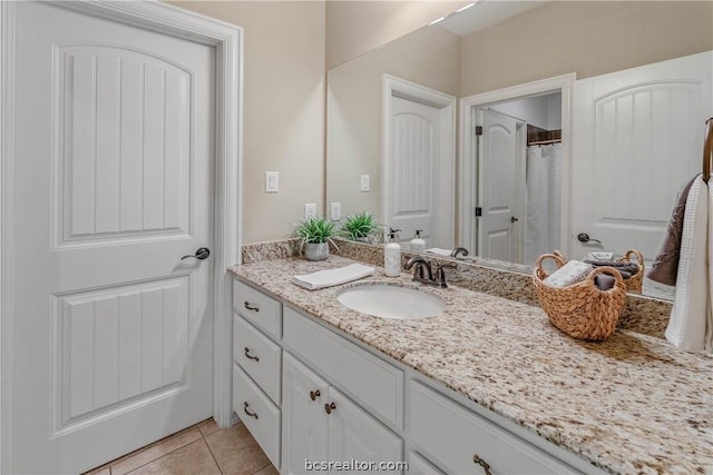 bathroom with vanity and tile patterned floors