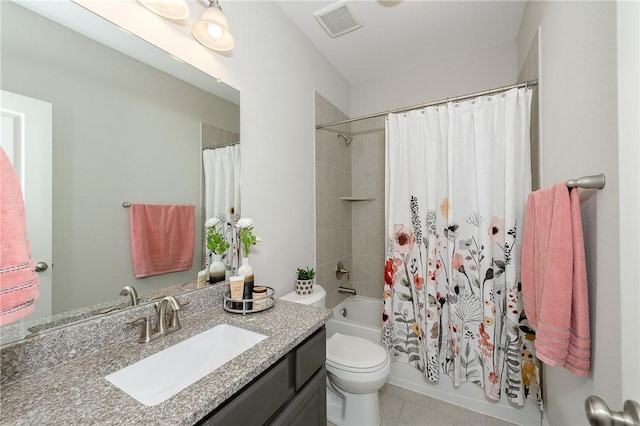 full bathroom featuring tile patterned flooring, vanity, toilet, and shower / bathtub combination with curtain