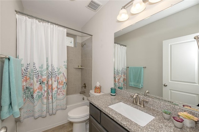 full bathroom featuring shower / tub combo, vanity, toilet, and tile patterned floors