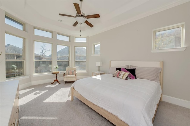 carpeted bedroom with ceiling fan and crown molding