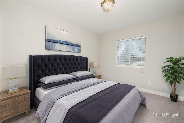 bedroom with light colored carpet