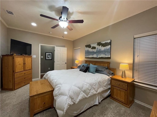 bedroom featuring ceiling fan, crown molding, and light colored carpet