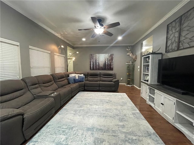 living room with ornamental molding, dark hardwood / wood-style floors, and ceiling fan