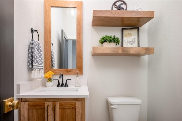 bathroom with vanity and toilet