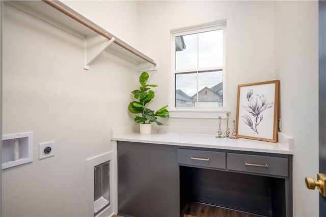 washroom with dark hardwood / wood-style floors and hookup for an electric dryer