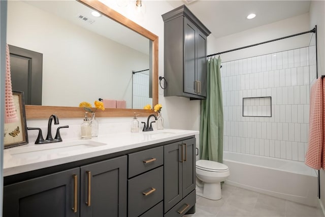 full bathroom with vanity, tile patterned floors, toilet, and shower / bath combo