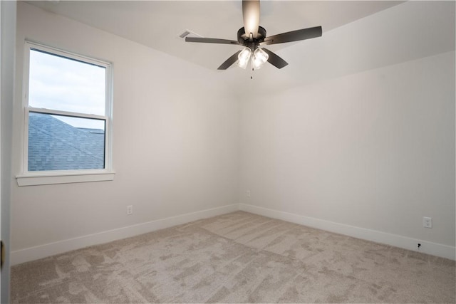 carpeted empty room with ceiling fan