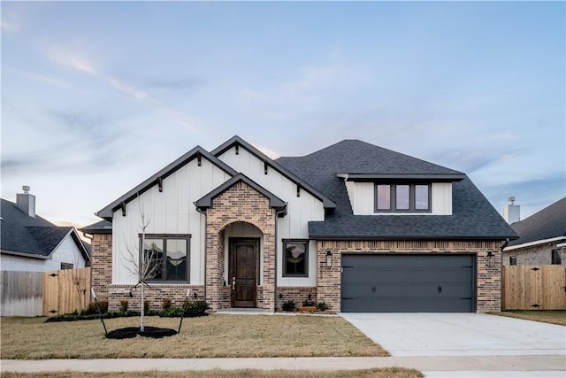 view of front of property with a garage and a front yard