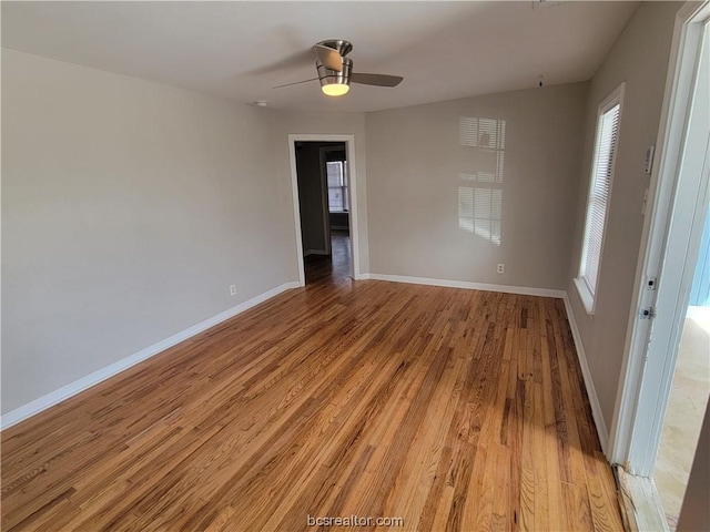 unfurnished room with ceiling fan and light wood-type flooring