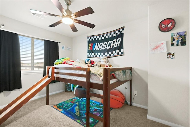 bedroom with visible vents, a ceiling fan, carpet flooring, and baseboards