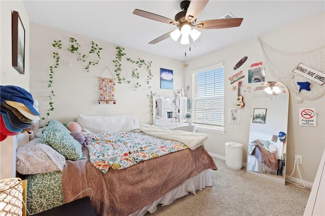 bedroom featuring a ceiling fan, visible vents, carpet, and baseboards
