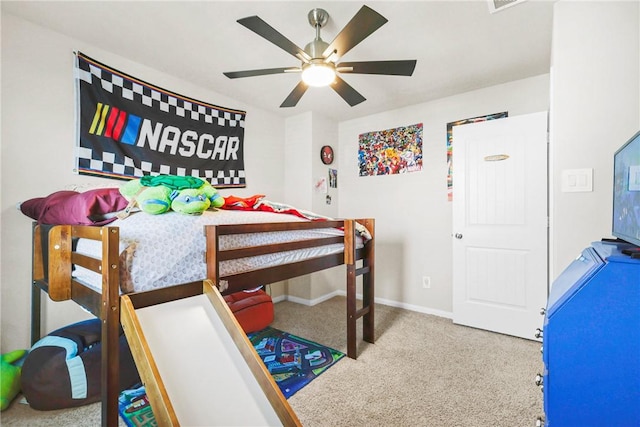 carpeted bedroom featuring a ceiling fan and baseboards