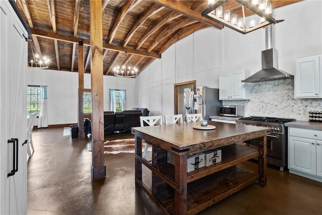 3520 Sykora Rd, Fayetteville, TX 78940 - kitchen featuring concrete flooring, high vaulted ceiling, stainless steel appliances, backsplash, and wall chimney exhaust hood