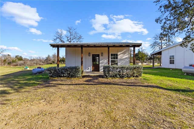 3520 Sykora Rd, Fayetteville, TX 78940 - view of front of property with a front yard and metal roof