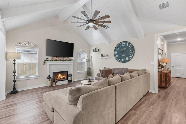 4019 Heru Ct, College Station, TX 77845 - living room featuring light wood finished floors, ceiling fan, and a fireplace