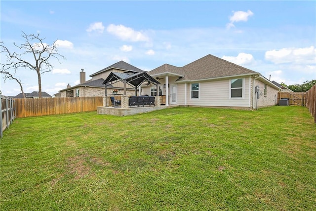 4019 Heru Ct, College Station, TX 77845 - rear view of property featuring a gazebo and a fenced backyard