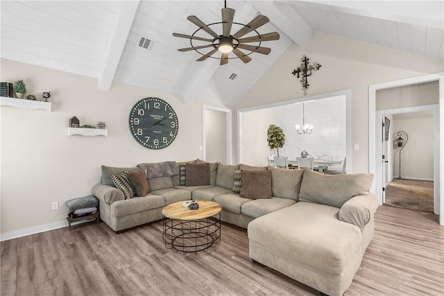 4019 Heru Ct, College Station, TX 77845 - living area featuring a ceiling fan, wood finished floors, and a chandelier