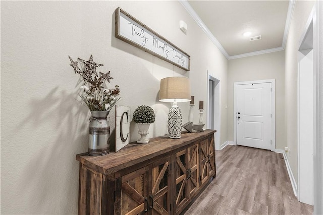 4019 Heru Ct, College Station, TX 77845 - entryway with ornamental molding and wood finished floors