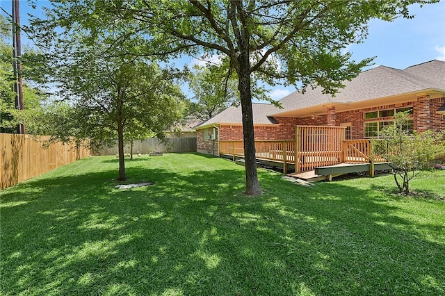 view of yard featuring a wooden deck