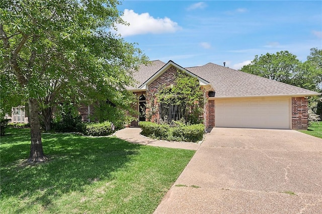 view of front facade with brick siding, a garage, a front yard, concrete driveway, and roof with shingles
