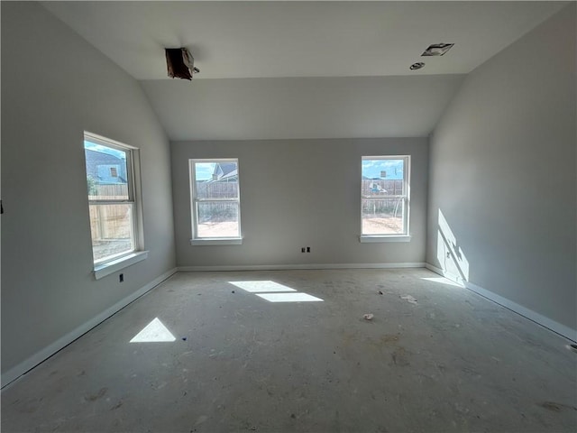 1935 Pinemont View Dr, Bryan, TX 77807 - empty room with vaulted ceiling, plenty of natural light, and baseboards