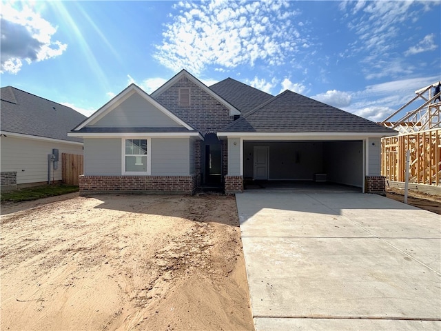 1935 Pinemont View Dr, Bryan, TX 77807 - view of front of house featuring brick siding, driveway, a garage, and fence