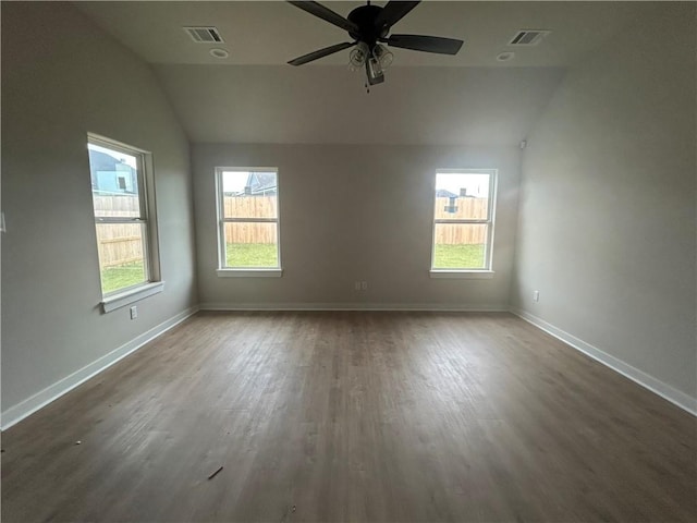 1935 Pinemont View Dr, Bryan, TX 77807 - spare room featuring vaulted ceiling, wood finished floors, and a ceiling fan