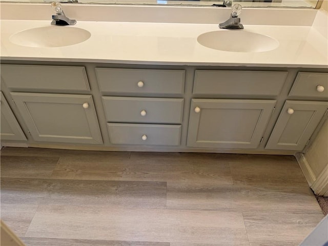 400 Nagle St Unit 304, College Station, TX 77840 - bathroom with double vanity and wood finished floors