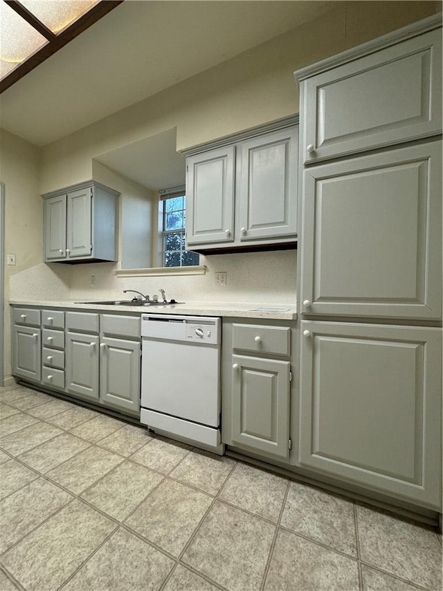 400 Nagle St Unit 304, College Station, TX 77840 - kitchen with dishwasher, gray cabinets, light countertops, and light tile patterned flooring