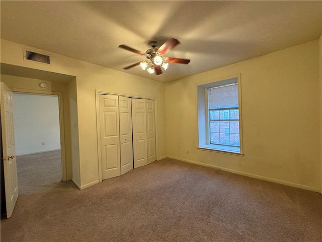 400 Nagle St Unit 304, College Station, TX 77840 - unfurnished bedroom featuring carpet, a closet, and ceiling fan