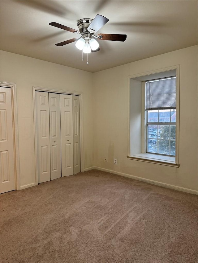 400 Nagle St Unit 304, College Station, TX 77840 - unfurnished bedroom featuring carpet flooring, multiple closets, and ceiling fan