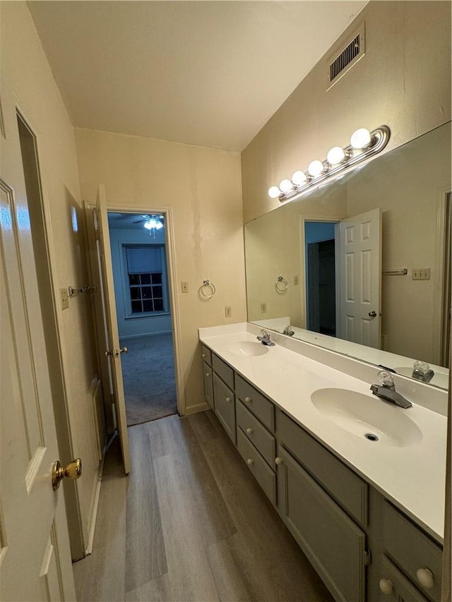 400 Nagle St Unit 304, College Station, TX 77840 - bathroom featuring wood finished floors and double vanity
